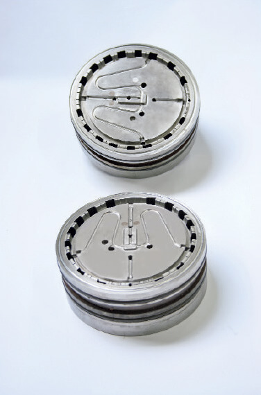 Inserts for an injection mould on which DMF Werkzeugbau has cut the square core penetrations on the circumference