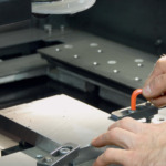 Stebler clamps a workpiece in the machine.