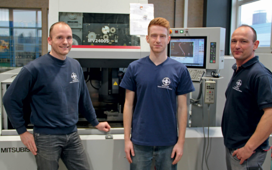 Stefan Reichl, design engineer, Fabian Kohel, operator, and Gerald Fischer, toolshop manager, work together on the development of new springs and the tools required.