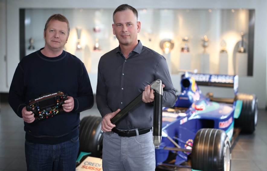Ernst Keller, Production Manager, and Axel Kruse, Operations Director, with EDM-machined elements of the current Formula One vehicle