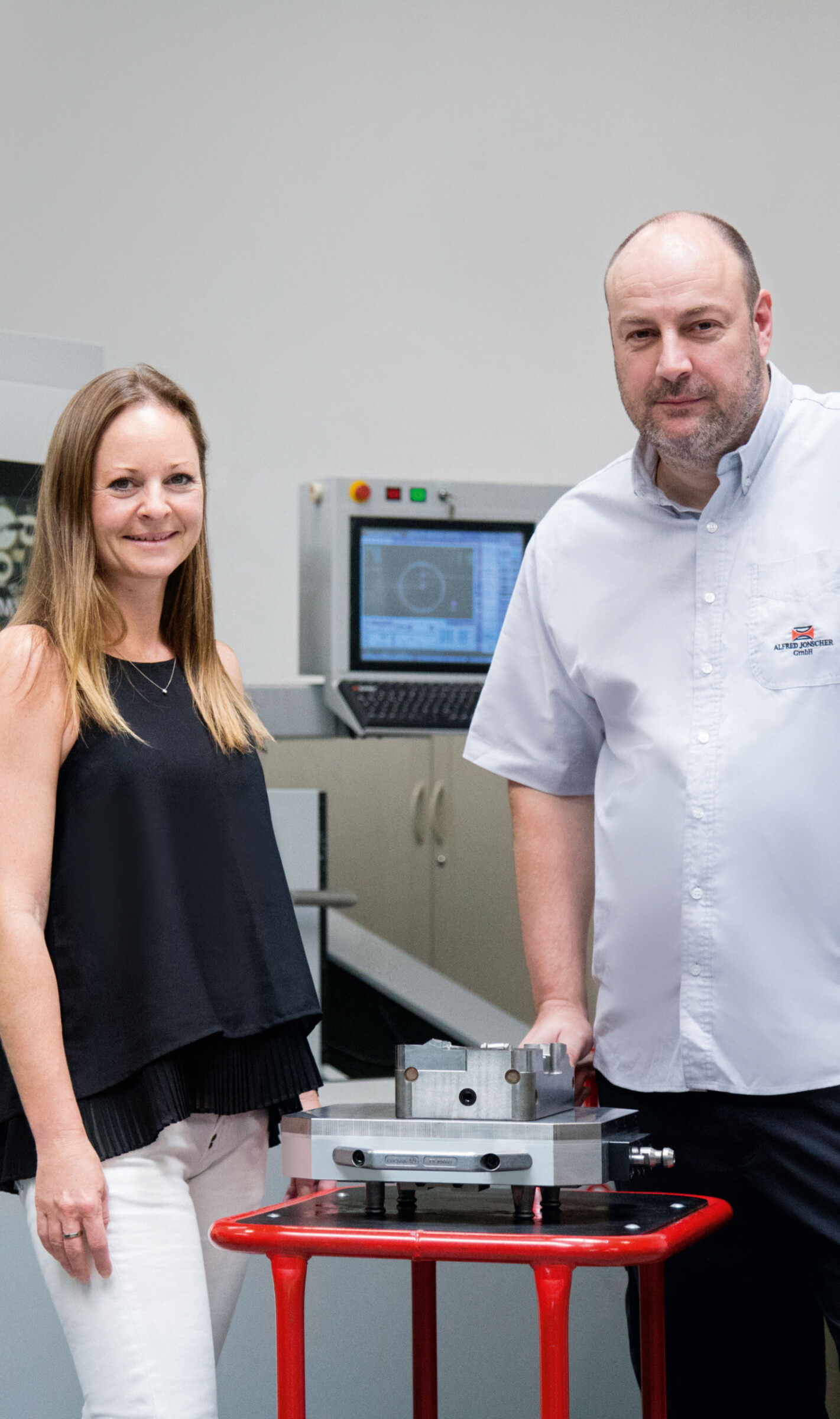 Natalie Pickshaus-Jonscher and Sven Siegmund inspecting an injection mould.