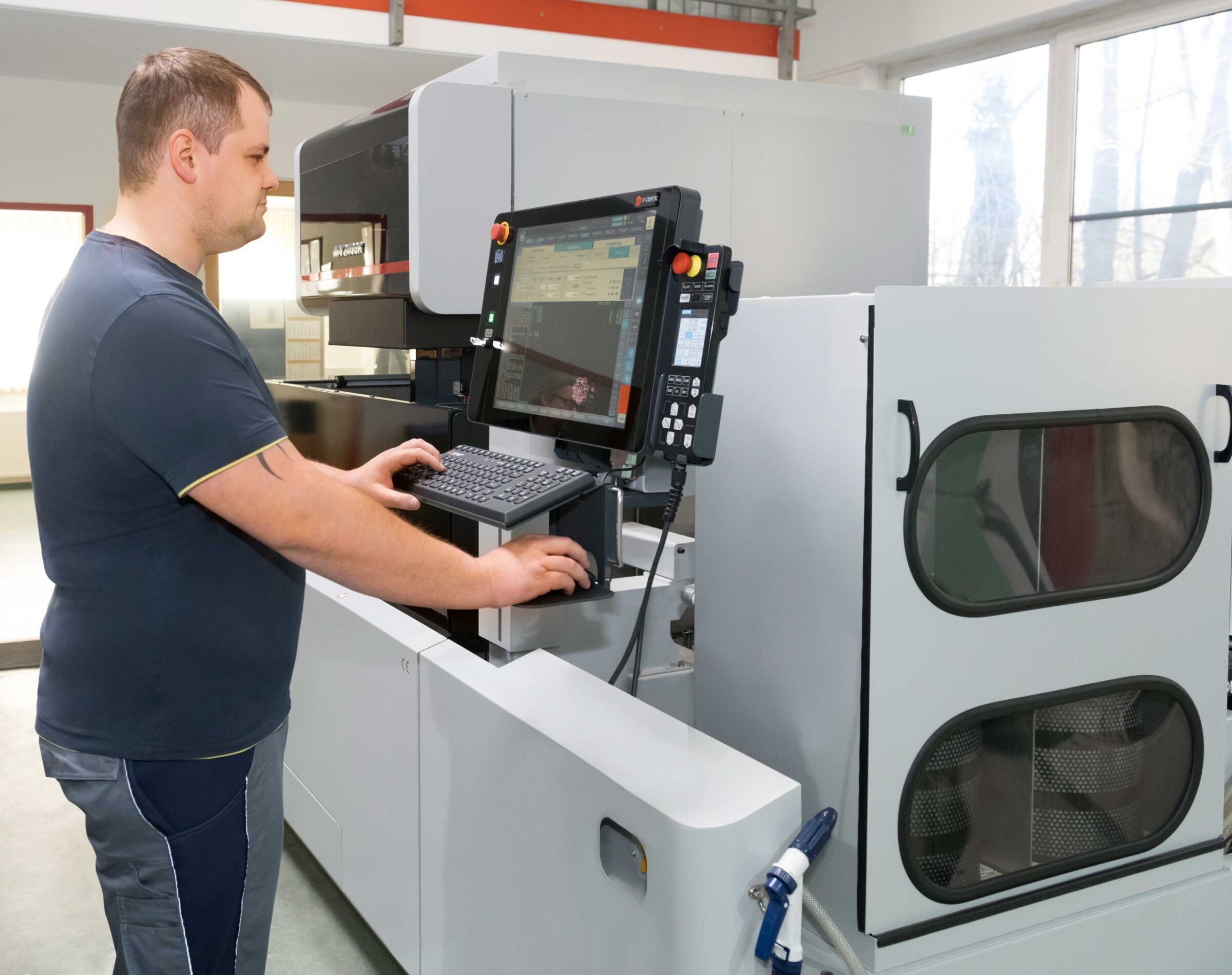 Daniel Mühlbacher during CAM program transfer and probing the workpieces prior to machining