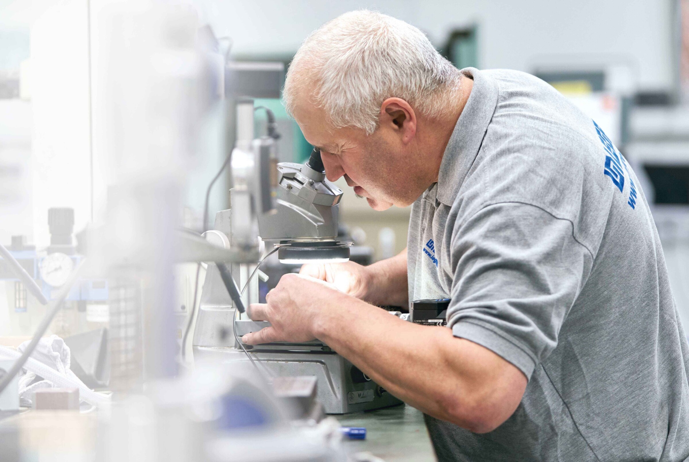 Volker Bader at microscopic inspection for highest precision